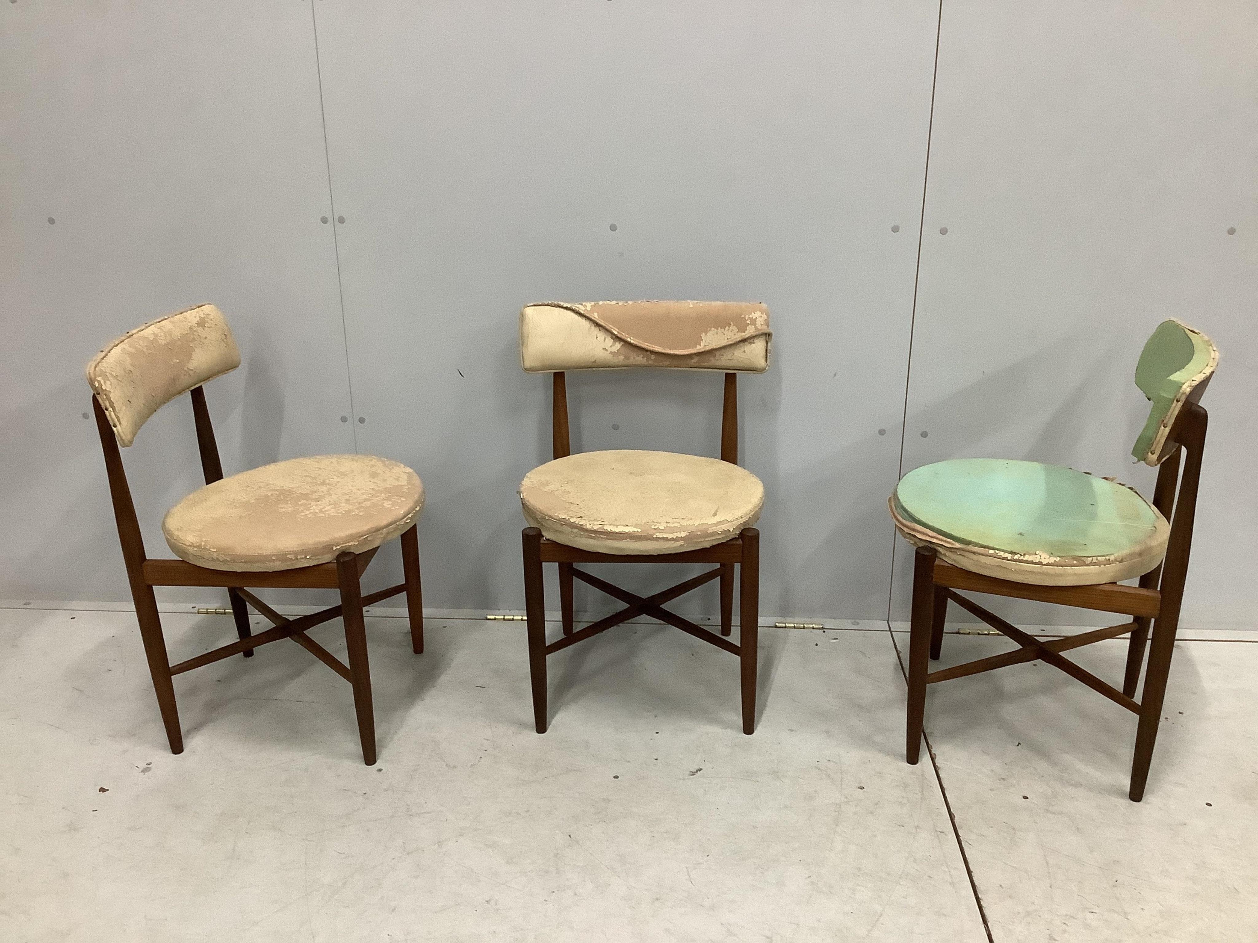 Three G-Plan teak dining chairs with circular seats. Condition - poor